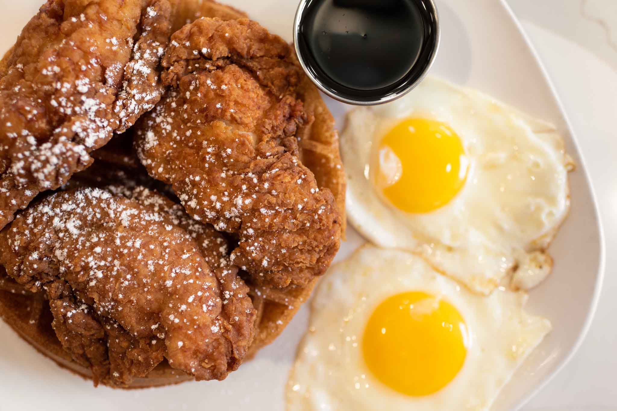 Chicken and Waffles with eggs on a plate at Jimmy's Egg, an Oklahoma restaurant.