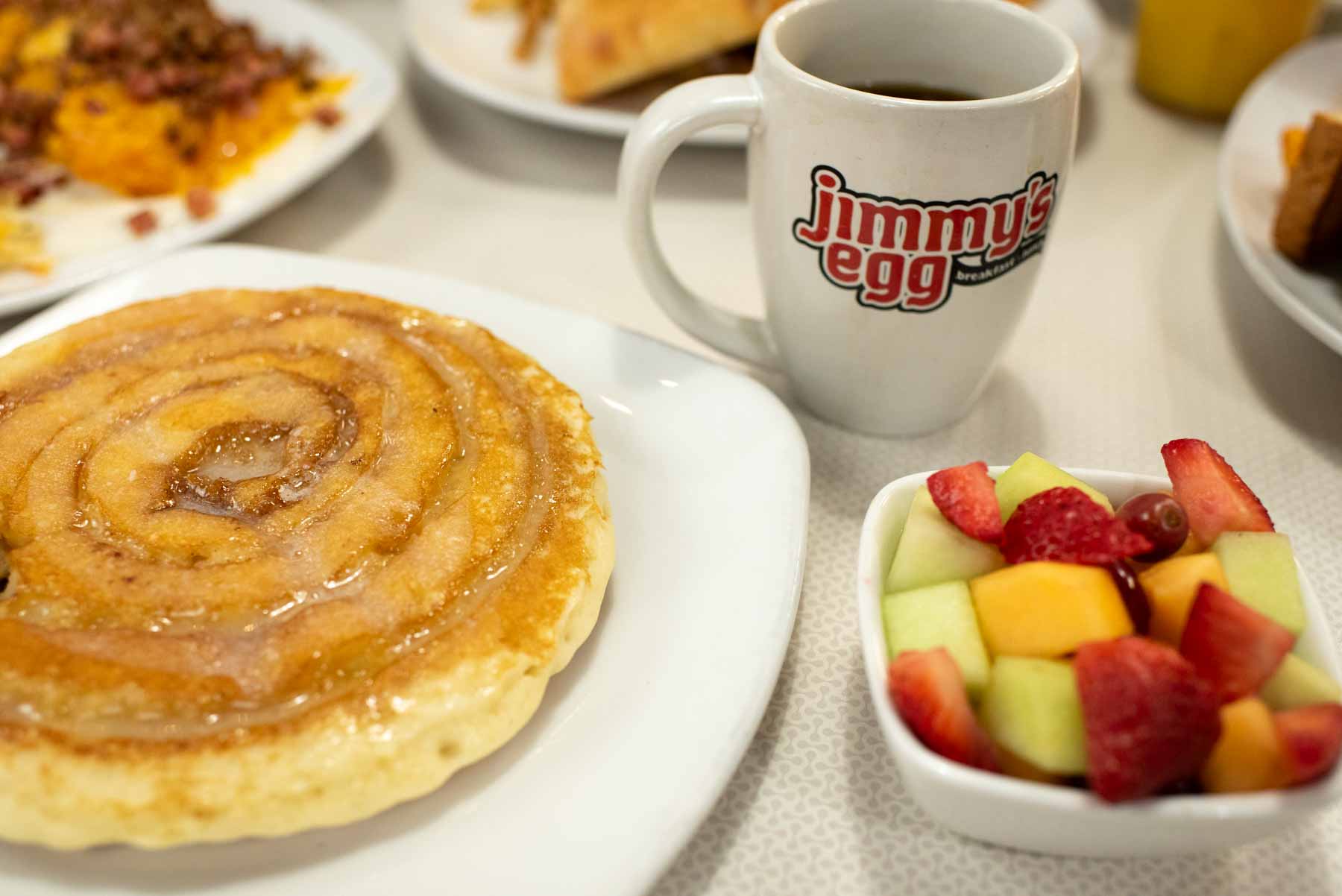 Jimmy's Egg Menu Options - Pancakes, Fruit, Coffee, Eggs, Burgers, and more.